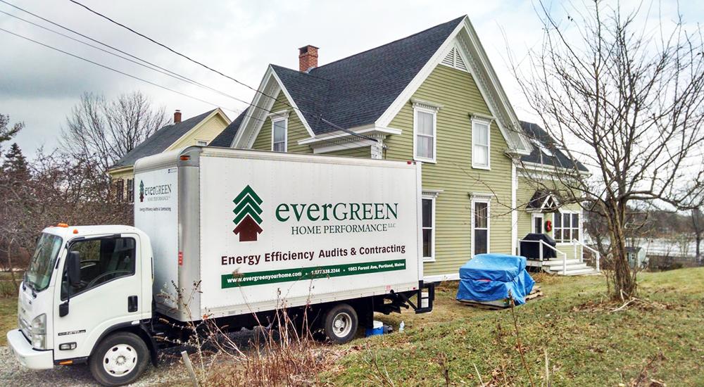 Evergreen Home Performance Truck Parked In Driveway Of A House